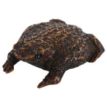 An unusual Victorian treen snuffbox in the form of a toad, with sliding lid under his belly,