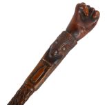 An ornately carved 19th century Folk Art walking stick, with inlaid metal playing card design