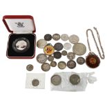 A group of commemorative coins, enamelled silver crown, and other coins