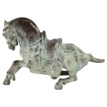 A Chinese verdigris bronze Tang style saddled horse, length 40cm