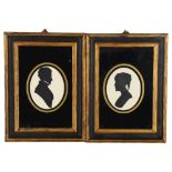 A pair of hand painted silhouettes, overall frame size 19cm x 14cm Good condition
