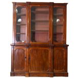 A Victorian mahogany breakfront bookcase, height 216cm, Width 168cm, depth 50cm Lower right cupboard