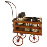 A rare Tri-ang toy milk cart, stained wood and metal, containing original tinplate milk churns and