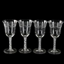 A set of 4 wine glasses with engraved bowls and opaque milk twist stems, height 19.5cm All in