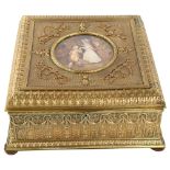 An ornate French gilt-metal casket, circa 1900, central hand painted ivorine panel depicting 2