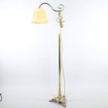 A Victorian polished brass standard lamp on heavy cast-brass platform base, recently re-wired,