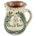 Ewenny pottery jug, with painted inscription "Dwfr da rhodd duw" (water gift of God), height 15cm