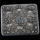 A Chinese export silver box, rectangular form with relief embossed chrysanthemum and character