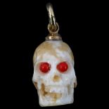 An Antique bone and coral skull charm/pendant, with unmarked yellow metal mount, height excluding