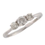 A modern 9ct white gold three stone diamond ring, set with modern round brilliant-cut diamonds,