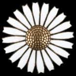 ANTON MICHELSEN - a Danish vermeil sterling silver and white enamel daisy pattern brooch, diameter