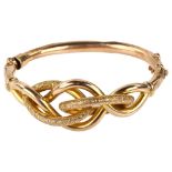 An Antique 9ct rose gold knot hinge bangle, textured and polished design, setting height 26.1mm,