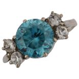 An early/mid-20th century blue zircon and white sapphire dress ring, unmarked white metal settings