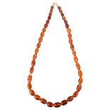 A Vintage amber and glass bead necklace, beads ranging from 18.3mm - 11.1mm, necklace length 62cm,