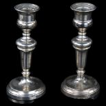 A pair of George V silver table candlesticks, by Edward Barnard & Sons, hallmarks London 1912,