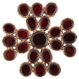 A large Victorian flat-top garnet Maltese Cross brooch, unmarked rose metal closed-back settings,