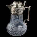 A late Victorian silver-mounted glass Claret jug, relief embossed and chased foliate decoration with