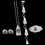 SOLVAR - an Irish silver-gilt newgrange spiral demi-parure, comprising pendant necklace, bracelet,