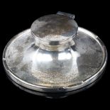 A George V silver Capstan inkwell, by A & J Zimmerman Ltd, hallmarks Birmingham 1912, diameter 15cm,