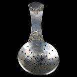 An Arts and Crafts unmarked silver tea caddy strainer spoon, length 10cm No damage or repairs,