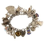 A silver curb link charm bracelet, with various silver charms, bracelet length 16cm, 85.1g No damage