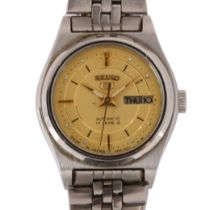 SEIKO 5 - a lady's stainless steel automatic bracelet watch, ref. 4206-0601, champagne dial with