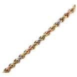 A Turkish 9ct three-colour gold cross bracelet, length 18.5cm, 3.9g No damage or repairs, only light