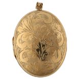 A large late 20th century 9ct gold photo locket pendant, engraved foliate decoration, hallmarks