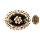 A Victorian onyx and pearl cluster mourning brooch, unmarked gold settings, and an Antique gilt-
