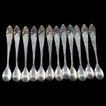 A set of 12 Chinese silver spoons, planished and relief floral decoration, maker's marks PK,