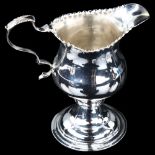 A George III silver helmet cream jug, indistinct maker's marks, hallmarks London 1793, height