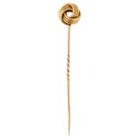 A Victorian knot stickpin, unmarked gold settings, head diameter 11.4mm, overall length 65.7mm, 4.1g