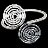 A handmade silver abstract torque bracelet, by C Wilkes, overall setting height 56.7mm, internal