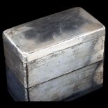 A large George VI rectangular silver cigarette box, by A & J Zimmerman, hallmarks Birmingham 1946,