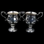 A pair of Irish George III silver 2-handled presentation trophy cups, circular bulbous form with