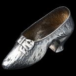 A late Victorian novelty silver lady's shoe, near life-size, by Nathan & Hayes, hallmarks Birmingham