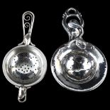 2 Danish stylised silver tea strainers, largest dated 1920, length 13cm, 2.4oz total (2) No damage