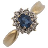 A modern 9ct gold sapphire and diamond cluster ring, set with oval mixed-cut sapphire and single-cut