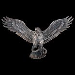 A large unmarked silver articulated eagle and snake pendant, wingspan 11cm, 39.7g No damage or