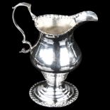 A George III silver helmet cream jug, by Joseph Lock, hallmarks London 1776, height 10cm, 2.6oz Base