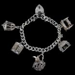 A silver curb link charm bracelet, with 5 silver charms, bracelet length 16cm, 47.7g No damage or