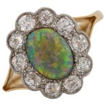 An 18ct gold black opal and diamond cluster ring, set with oval cabochon black opal and old