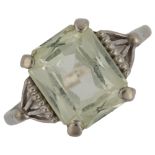 An American 9ct gold green stone dress ring, setting height 10.2mm, size L, 2.1g No damage or