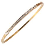 A modern 9ct gold diamond hinged bangle, channel set with modern round brilliant-cut diamonds, total