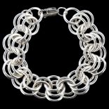 A heavy silver multi-link chain bracelet, by C Wilkes, length 19cm, 60.2g No damage or repairs, no