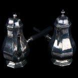 A pair of Edwardian silver cafe au lait pots, octagonal baluster form with ebony side pouring