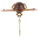 A First World War Period 9ct gold Fumsup good luck charm bar brooch, with carved wood head and glass