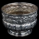 A large early 20th century unmarked silver rose bowl, circular bulbous form with relief embossed