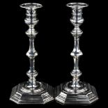 A heavy matched pair of Edwardian silver table candlesticks, in 18th century style, by Carrington Co