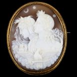 A 19th century shell cameo brooch, relief carved depicting Eos and Nyx (Goddesses of dawn and